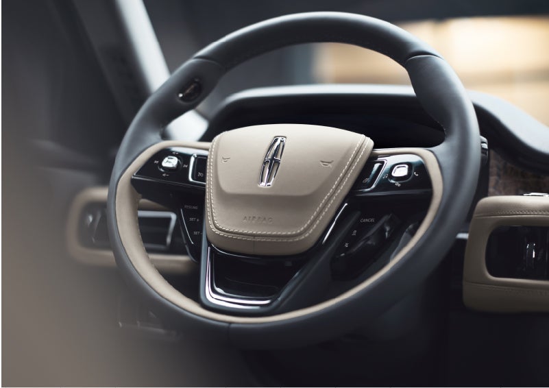 The intuitively placed controls of the steering wheel on a 2023 Lincoln Aviator® SUV | Cogswell Lincoln in Russellville AR